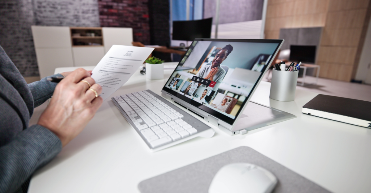 Job interview preparation for a virtual interview with resume review and video call setup